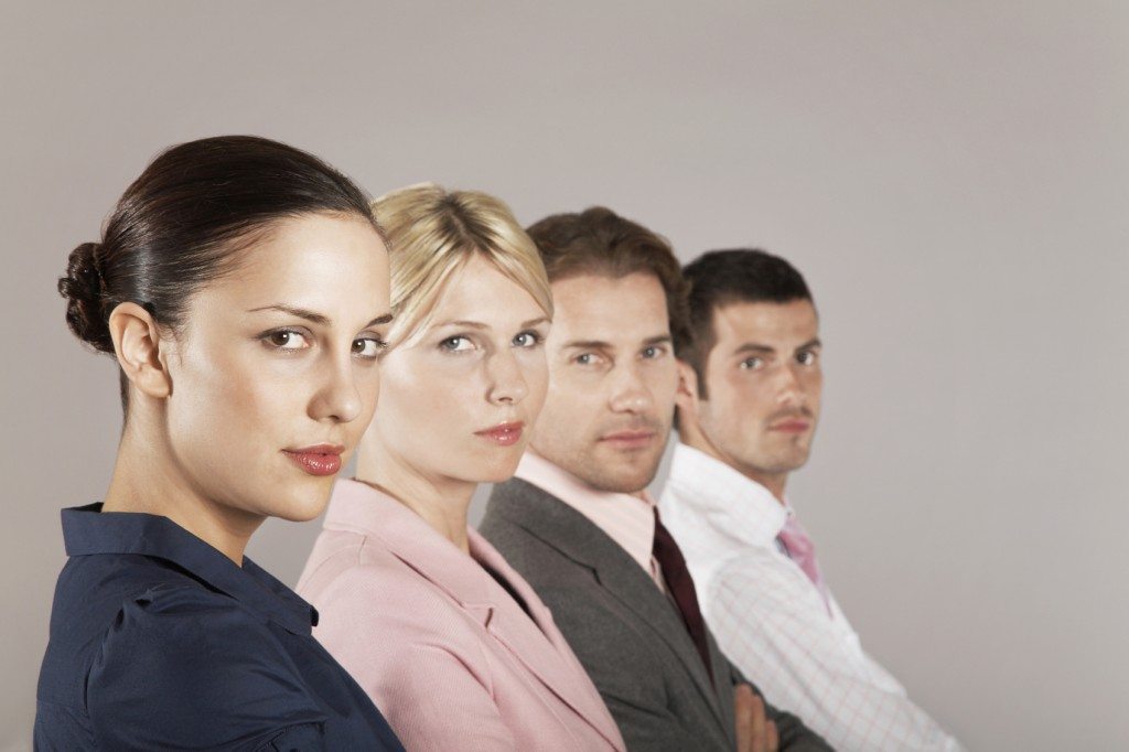 Portrait Of Businesswomen And Men In Row - XLerant